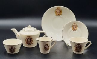 LOT 148 (329071/49) Est R300 to R600 - A Commemorative 1937 Coronation Glazed Wadeheath Pennington Earthenware Art Deco-style Doll's Tea Set