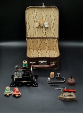 LOT 202 (32569) Est R500 to R1500 - An Early 20th Century German Child's Cased Sewing Machine Set circa 1930s