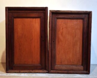 LOT 113 (32911) Est R4000 to R8000 - A Graduated Pair of Hand Wrought Hanging 19th Century Rustic Cape Yellowwood and Stinkwood Kombuiskaste/Kitchen Cabinets
