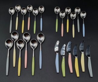 LOT 32 (33032) Est R1000 to R3000 - A Scarce Mid 20th Century Finnish Hackman Stainless Steel and Nylon Composite hafted Lion pattern 24-piece Dessert flatware Set circa 1960s (Pastel Colourway)