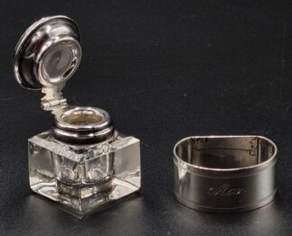 LOT 17 (32914) Est R700 to R1500 - An Elizabeth II Portable Clear Glass Inkwell fitted with a Silver Mounts