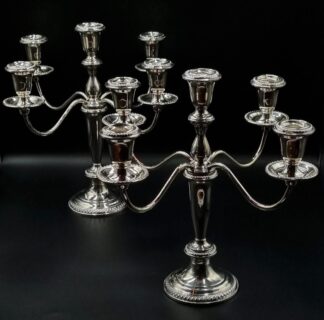 LOT 24 (32934) Est R10000 to R20000 - A Pair of Elegant American Sterling Silver Hollow-cast and Weighted Neoclassical-style Five-light Table Candelabra
