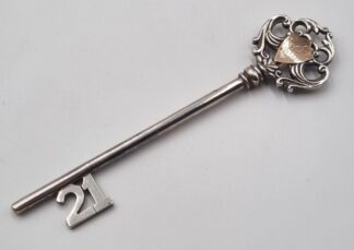 LOT 393 (32938) Est R1000 to R3000 - A Mid-20th Century Continental Sterling Silver 21st Birthday Presentation Key with Applied 9ct Yellow Gold Shield Cartouche Plaque