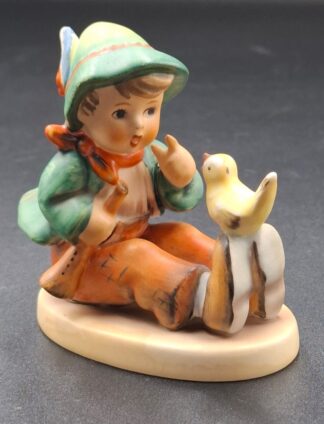 LOT 99 (329353/43) Est R100 to R300 - A West German  M.I. Hummel porcelain figurine, Singing Lesson