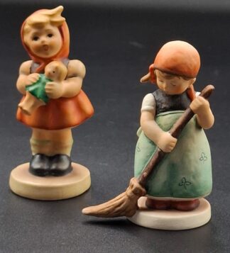 LOT 101 (329355/43) Est R200 to R400 - A West German  M.I. Hummel porcelain figurine, Girl with Doll (Mädchen mit Puppe)