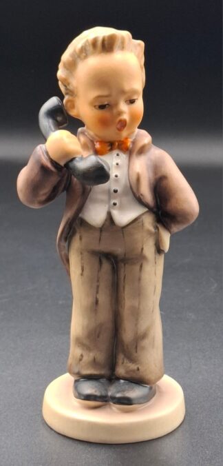 LOT 103 (329357/43) Est R300 to R600 - A West German  M.I. Hummel porcelain figurine, Hello (Rufst du)