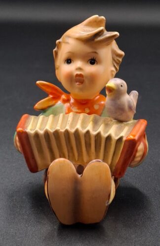 LOT 112 (3293516/43) Est R200 to R400 - A West German W. Goebel M.I. Hummel porcelain figurine, Let's Sing/ Lark Songs (Lerchenlieder)
