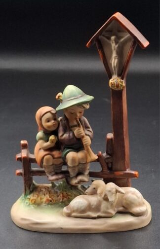 LOT 108 (3293512/43) Est R500 to R1500 - A West German  M.I. Hummel porcelain figure group, Wayside Devotion/ Evening Song (Am Wegealtar/Abendlied)