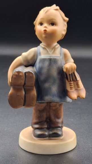LOT 115 (3293519/43) Est R200 to R400 - A West German W. Goebel M.I. Hummel porcelain figurine, Boots (Meister Wichtig)