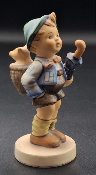 LOT 118 (3293522/43) Est R200 to R400 - A West German W. Goebel M.I. Hummel porcelain figurine, Home from Market/Lucky Purchase (Glückskauf)