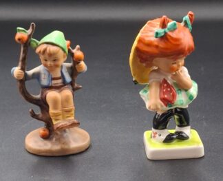 LOT 124 (3293531/43) Est R300 to R600 - A Post-war German W. Goebel M.I. Hummel porcelain figurine, Apple Tree Boy (Frühling) (Miniature version)