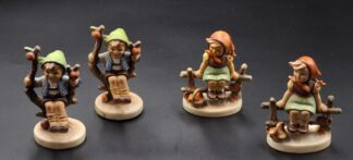 LOT 125 (3293532/43) Est R400 to R800 - A Collection of 4 x W. Goebel M.I. Hummel porcelain figurines, 2 x Apple Tree Boy (Frühling/Herbst) and 2 x Just Resting (Mutters Liebste) of various dates