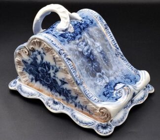 LOT 132 (33007) Est R1000 to R3000 - A Late Victorian Glazed Earthenware Flow Blue Stilton Cheese Dish and Cover in the Rococo Taste