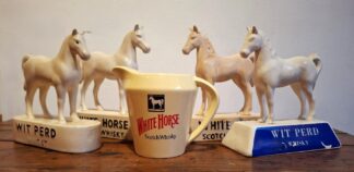 LOT 245 (32941) Est R500 to R1500 - A Collection of 4 x Vintage Ceramic 'White Horse Scotch Whiskey' Horse Statues