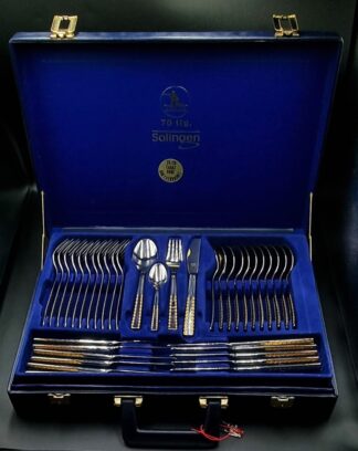 LOT 65 (329) Est R1000 to R3000 - A Fine German Stainless Steel 18/10 Jager Solingen Cutlery Service for Twelve with 23/24 Karat Hartvergoldet (Plated) Finishes circa 1990s (70pcs)