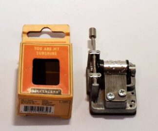 LOT 195 (33132) Est R100 to R300 - A Novelty Miniature American manufactured Manual Wound Music Box