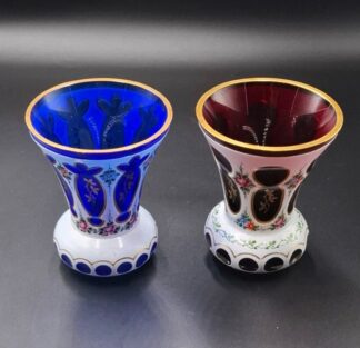 LOT 106 (33119) Est R500 to R1500 - A Matched Pair of Czech Flash-cut Cobalt and Ruby Milk Glass Encased Milk Glass Waisted Cabinet Vases