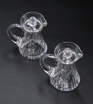 LOT 94 (32974) Est R400 to R800 - A pair of Stuart and Sons Ltd (Stuart Crystal ) Art Deco period (1925-1939) Syrup Jugs with removable finialled covers, designed by Ludwig Kny circa 1935