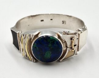 LOT 289 (329862) Est R2000 to R4000 - A Stephen Colgate (English born 1947 - ) designed Ladies Silver and Gold Amulet Bracelet circa 1970s-1980s