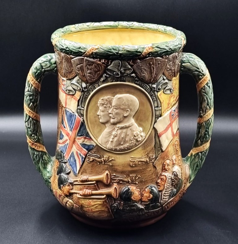 LOT 178 (329071) Est R3000 to R6000 – A Royal Doulton Commemorative Silver Jubilee (1910-1935) Glazed Earthenware Loving Cup (Uncrowned version), designed by Harry Fenton and Charles Noke
