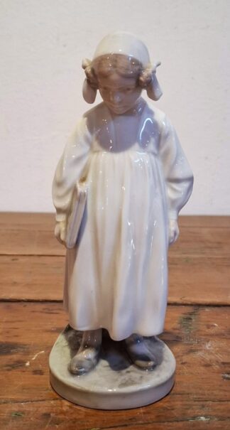 LOT 166 (33119) Est R300 to R600 - A Royal Copenhagen porcelain Figurine, Girl with Book (Night time Reading)