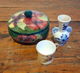 LOT 164 (33163) Est R500 to R1500 - A Walter Moorcroft Ceramic Hibiscus Bowl with detachable finialled domed cover circa 1950s