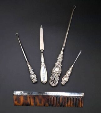 LOT 54 (32975) Est R500 to R1500 - A Collection of Edwardian Ladies Silver Hafted Dressing Table Accoutrements with Cast Steel Terminals